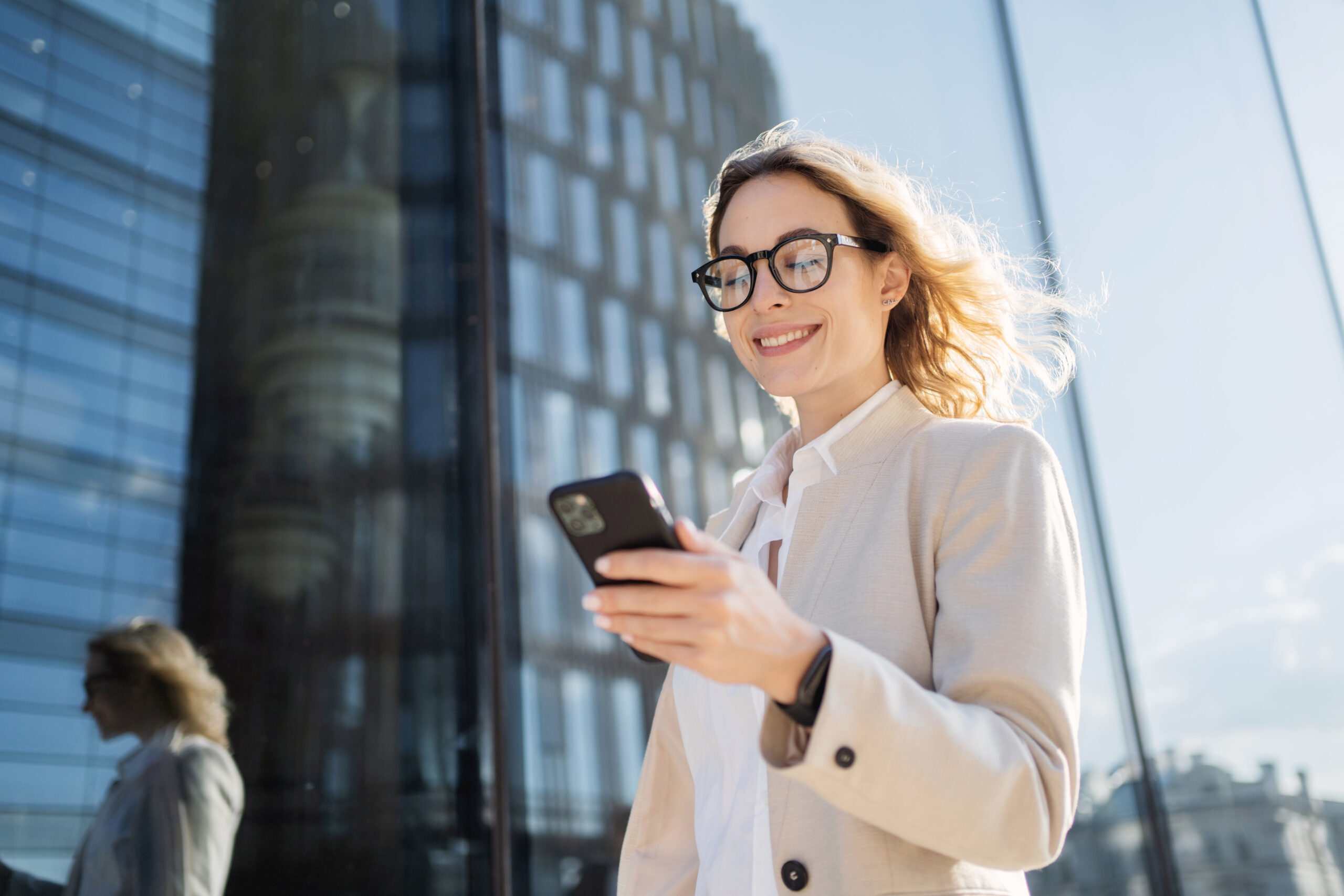 uses a phone device in his hands, communicating with a colleague